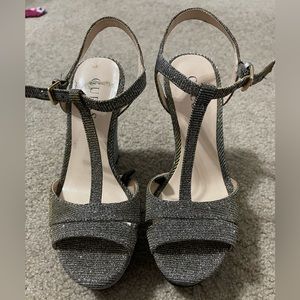 Black and gold wedge heels